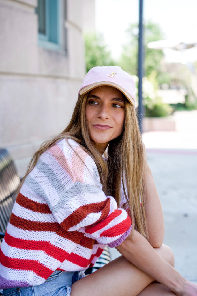 ultra light pink chambray dad hat with gold emblem