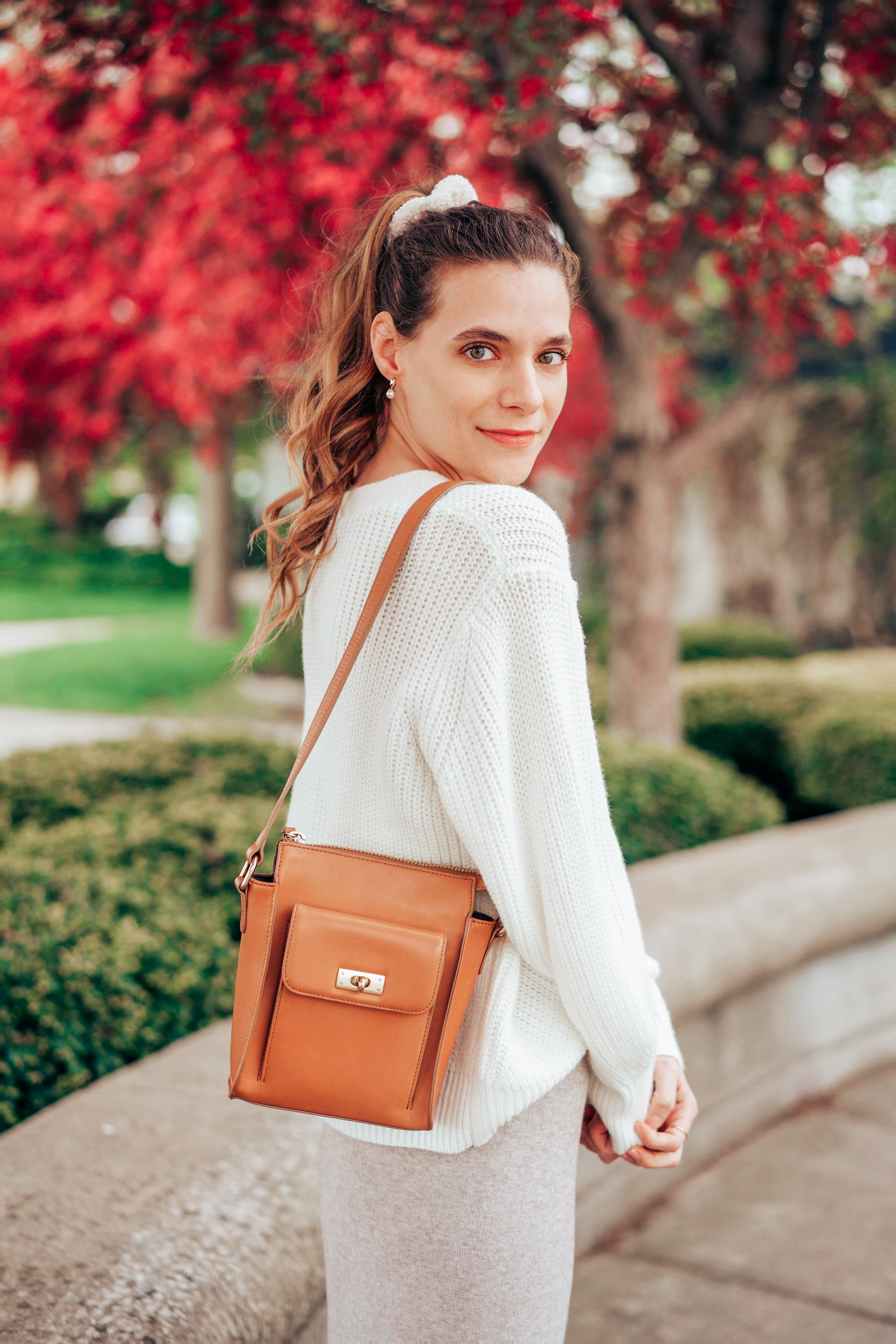 white hair scrunchie and white sweater set